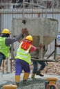 Group of construction workers concreting slab at the construction site